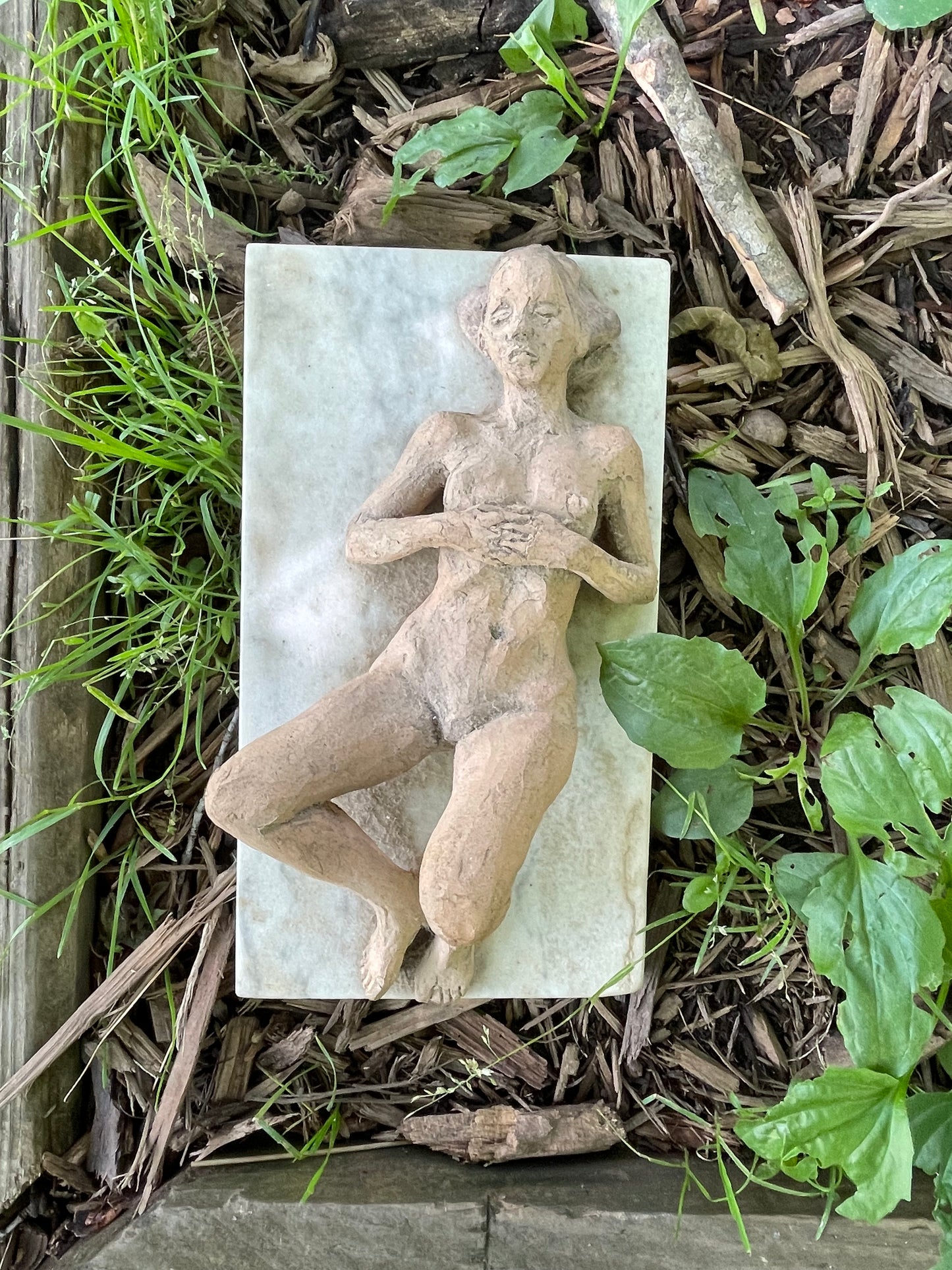 Reclined Figurative Sculpture on Marble